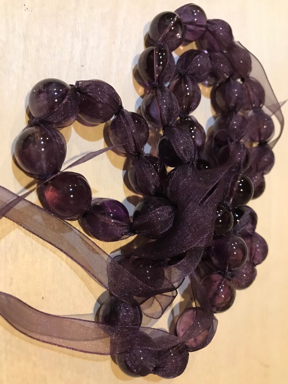 Simon Alcantara necklace of amethyst bead with silk ribbon. Unworn Stanley Korsh